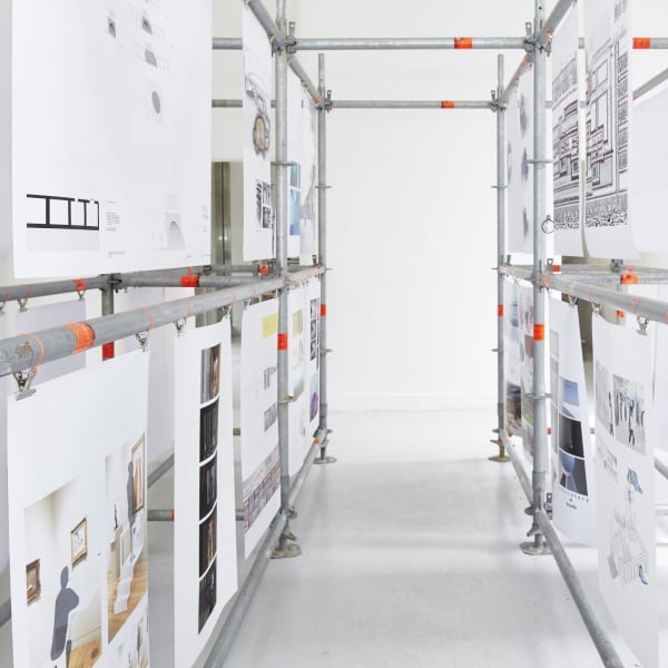 BA Interior and Spatial Design show installation made with scaffolding and posters.