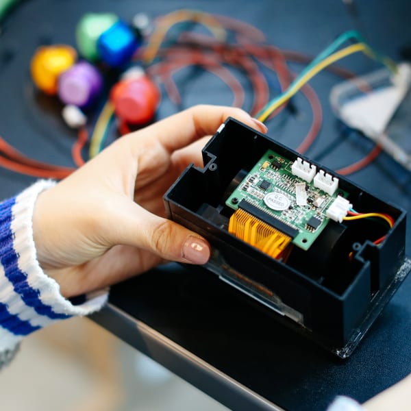 Close up of student working with technical equipment