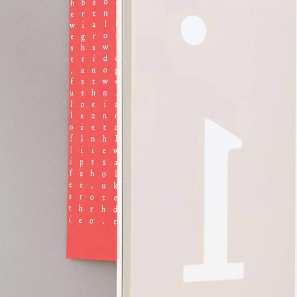 Close-up of a book, showing a large printer letter 'F'.