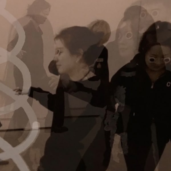 Photograph of people moving around a room with a white squiggly line drawn over the top.