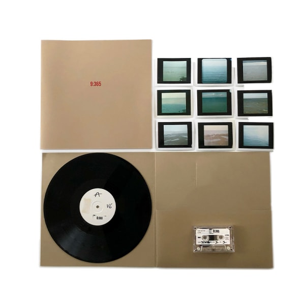 A display showing a record, a series of photographs and a cassette-tape. 
