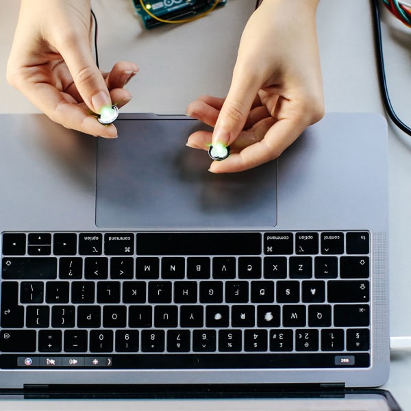 Close up image of someone holding computing equipment