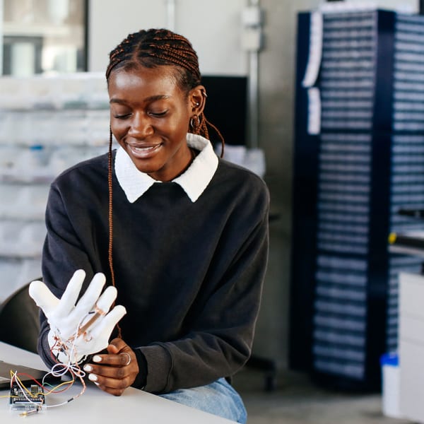 Student wearing a white computational glove