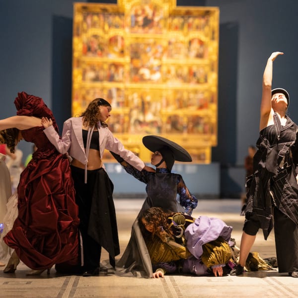 Performers in an art gallery