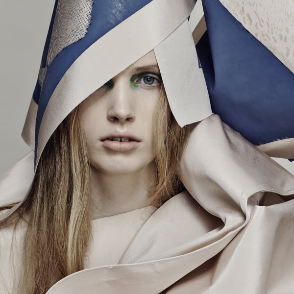 Female model in cream and blue material.