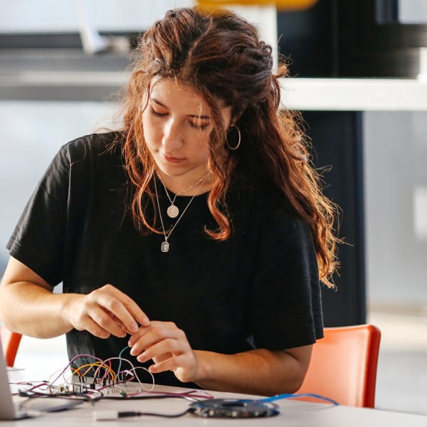 Rocio Aloe Rey working with computing components