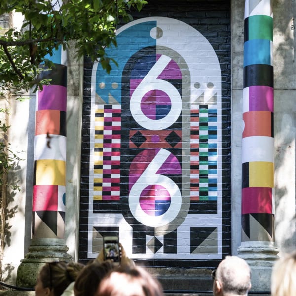 Multi-coloured mural of the number 66 painted by Alastair Ramageas as part of a project for Clerkenwell Design Week.