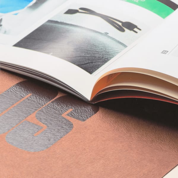 Photo of books and magazines detailing graphic design elements
