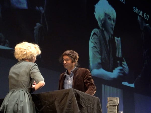 Performance on stage and on screen with cameras present