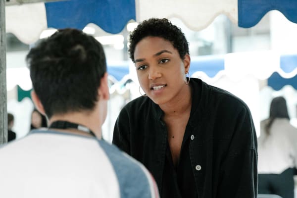 Two people talking at the part time job fair