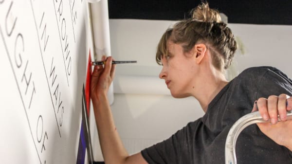 Woman working in a Students' Union project space