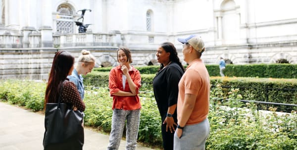 Students chatting in front of Tate Britain, it's summer.