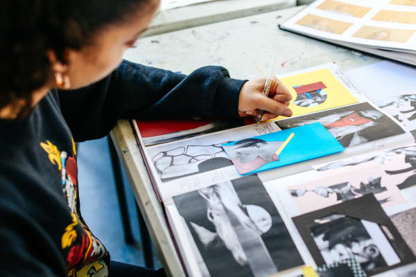 Student leaning over her work 