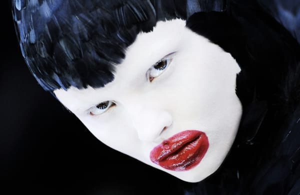 Model with white face red lips