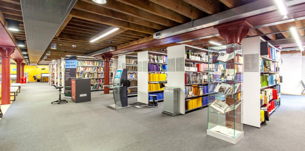 Rows of books and open area at CSM Library
