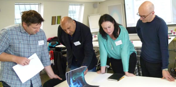Teachers discussing final major projects