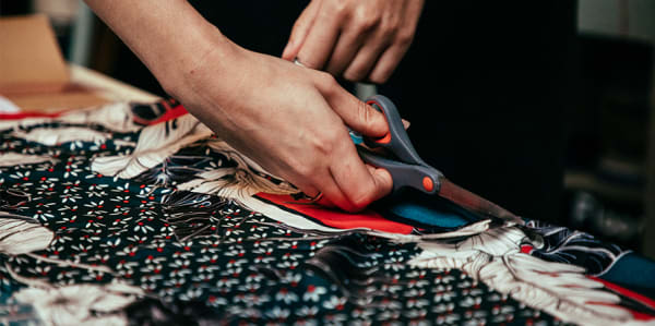 Close up of fabric being cut 