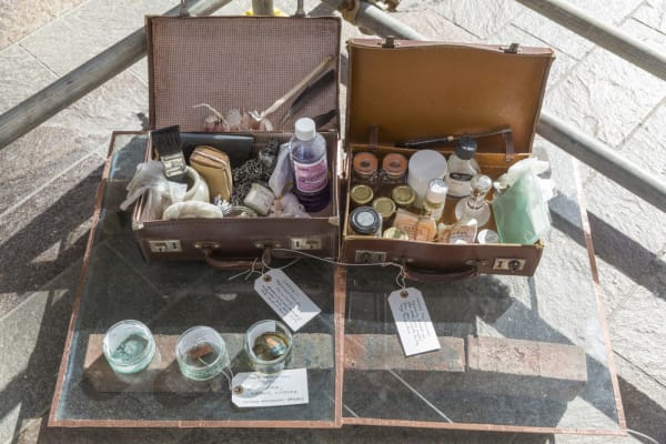 A casket of bottles in golden light