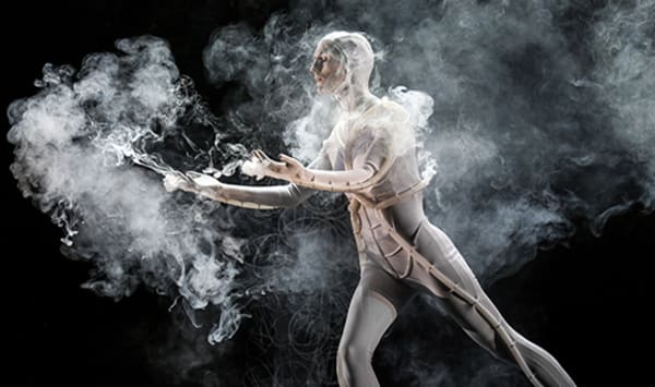 Photo of a man in a body suit surrounded by smoke