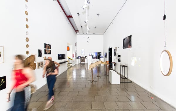 Figures walking through the Atrium Gallery.