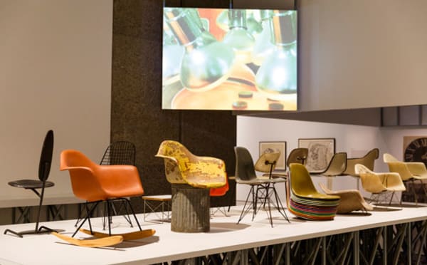 Chairs on a stage with a projector screen