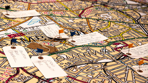 Map of Southwark with pins and tags with writing on them about local places.