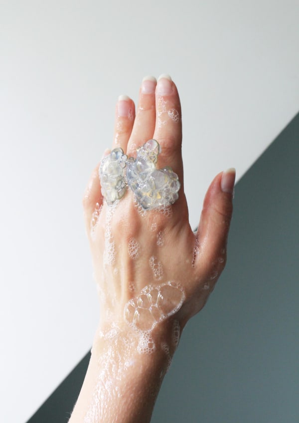 Hand with ring that appears like bubble