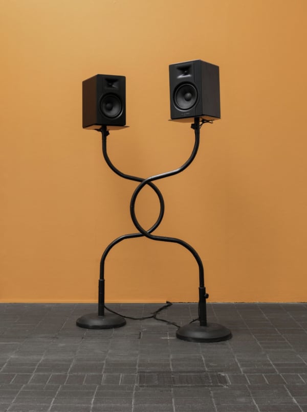 Two big speakers with twisted polls.