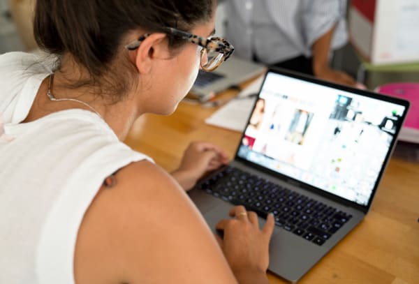 Student on laptop in classroom