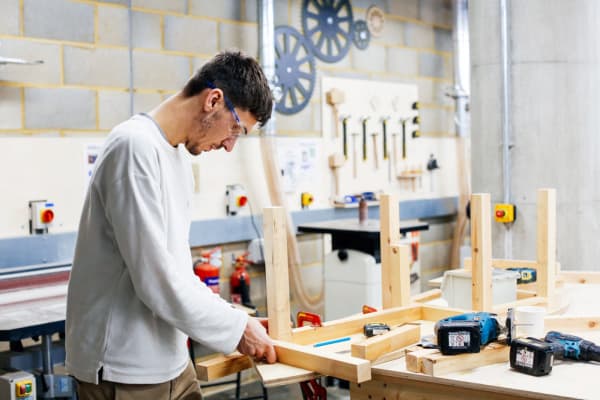 Boy assembling a wooden model 