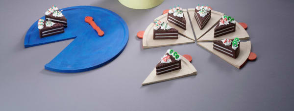 Student work of ceramic plates and cake.