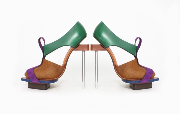 A pair of green, blue and brown shoes produced by a student at London College of Fashion