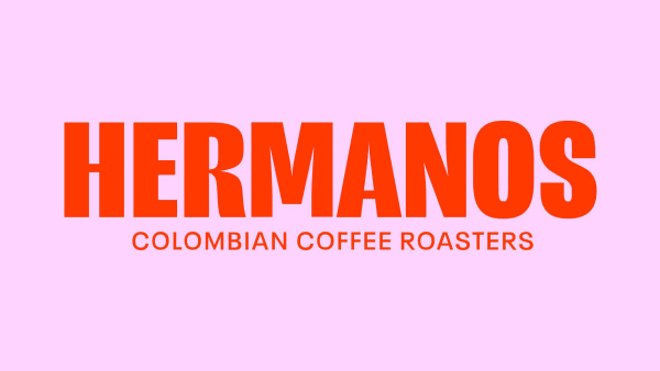 Pink background with red text 'Hermanos' printed