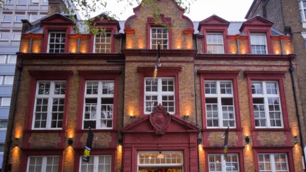 The exterior of a large brick building