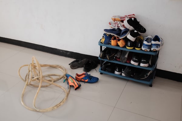 A shoe rack with trainers