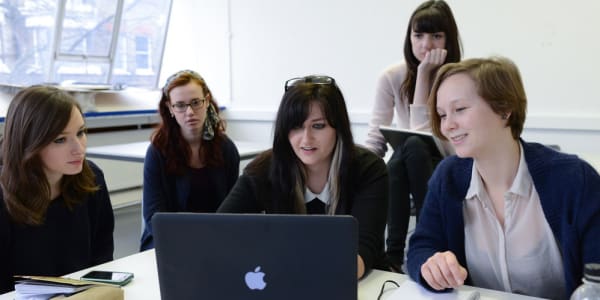 Students in front of laptop