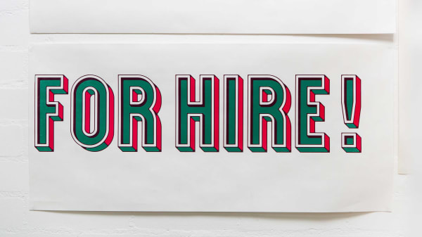 Photo of a letter print that says For Hire