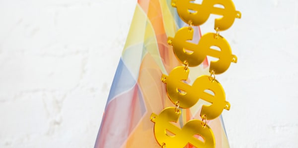 Pastel colorful textiles with metal gold dollar signs decoration