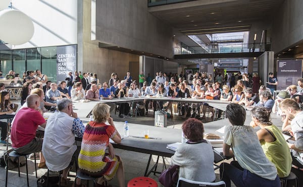 People sat around a large round table 