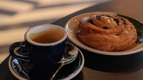 Espresso and pastry on a plate