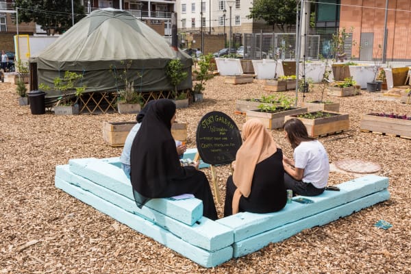People sat around a blackboard 