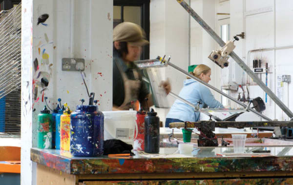 Photo of a woman working at a work bench