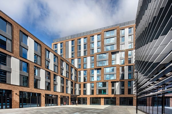 an exterior of a four-storey building with courtyard