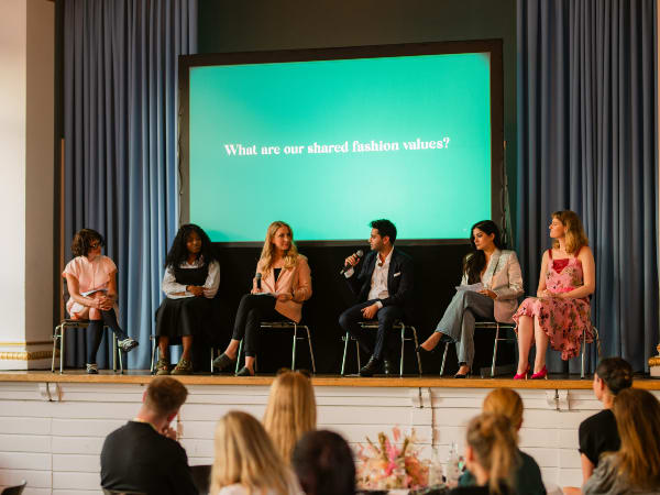 Guest speakers on stage.