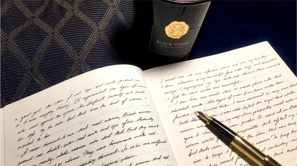 handwritten text on lined paper and fountain pen