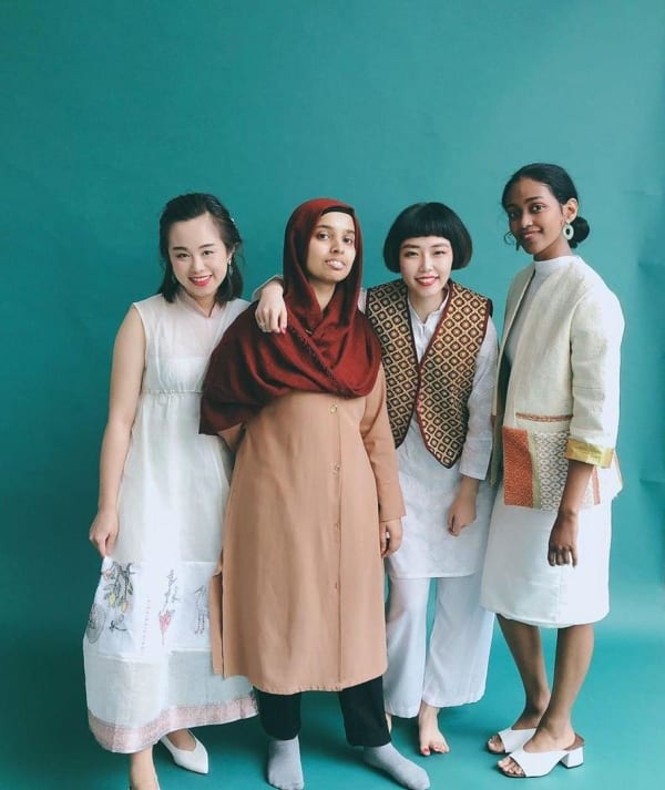 4 girls of different background hanging out in a photography studio