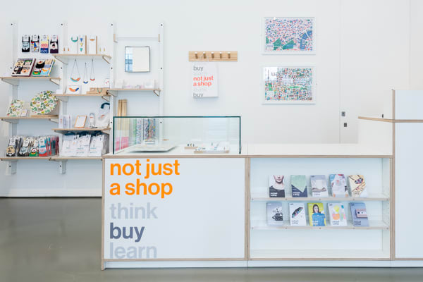  Retail interior with a minimalist aesthetic. The counter reads 