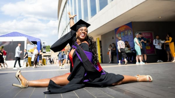 LCFalum doing the splits outside the graduation ceremony in London