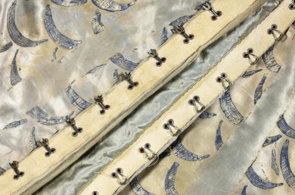 Grey blue silk fabric with metal fastenings