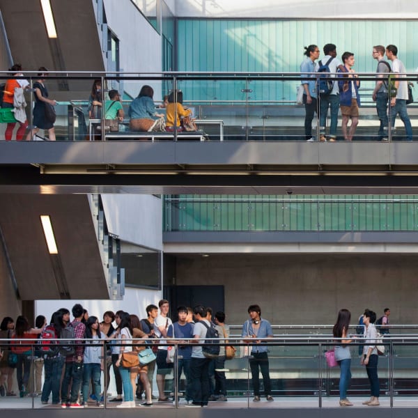 Students at King's Cross seen in the middle distance